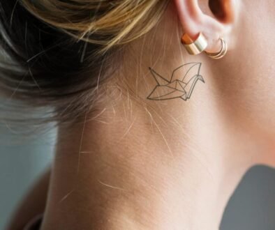 closeup-of-a-simple-behind-the-ear-tattoo-of-a-you-2026-01-07-23-29-03-utc
